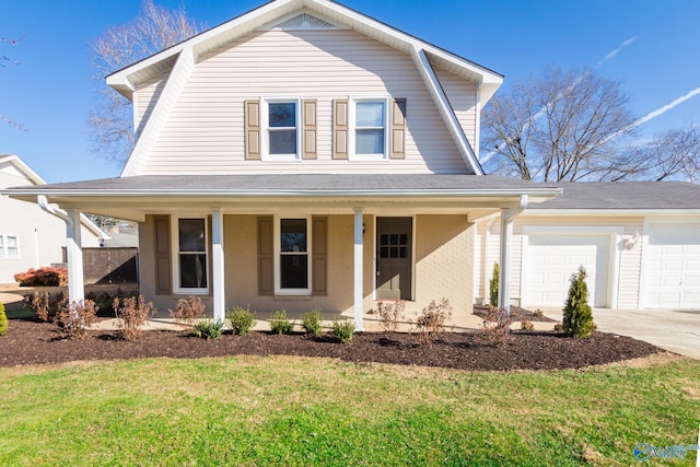 view of front of home with a garage, covered porch, and a front lawn