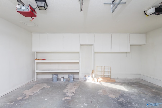 garage featuring a garage door opener