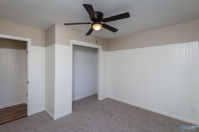 unfurnished bedroom featuring light carpet, ceiling fan, and a closet