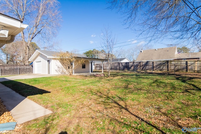 view of yard with a garage and an outdoor structure