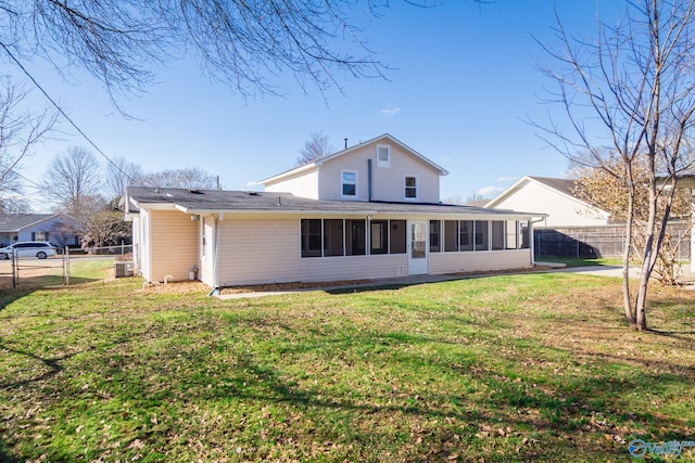 back of property featuring a lawn
