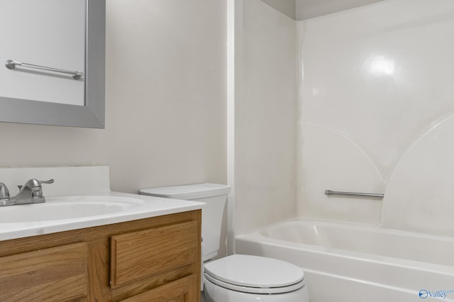 bathroom with bathtub / shower combination, vanity, and toilet