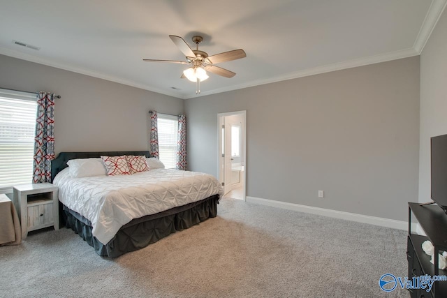 carpeted bedroom with multiple windows, ceiling fan, ensuite bathroom, and ornamental molding