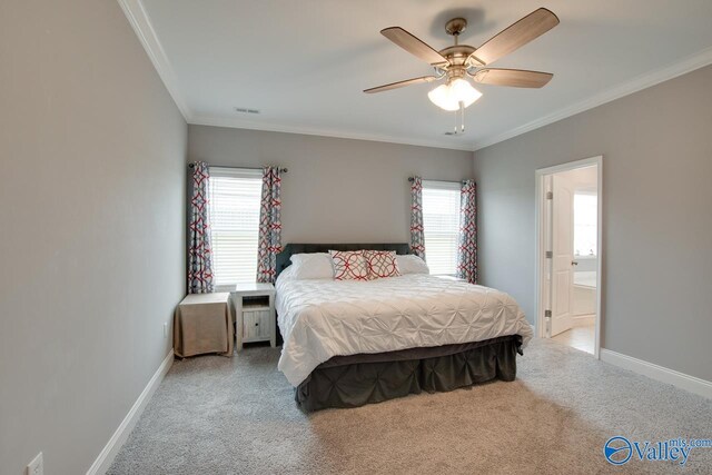 bedroom featuring light carpet, crown molding, and ceiling fan