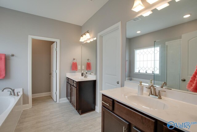 bathroom featuring a bathing tub and vanity