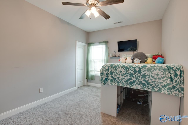 carpeted home office with ceiling fan