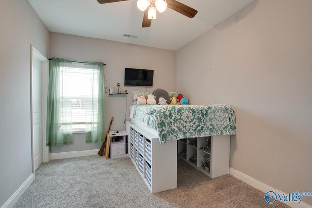 carpeted bedroom featuring ceiling fan