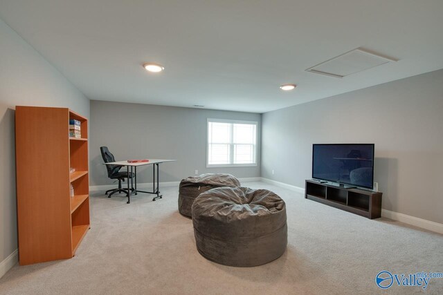 sitting room featuring carpet floors