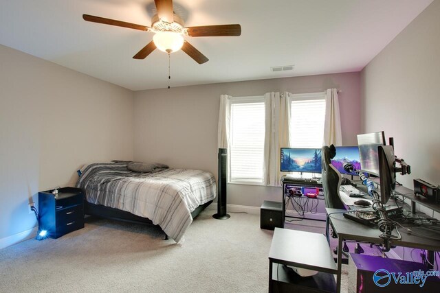 bedroom featuring ceiling fan and carpet floors