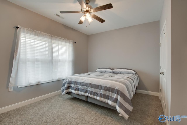 carpeted bedroom with ceiling fan