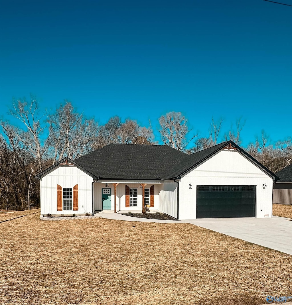 view of front of house with a garage and a front yard