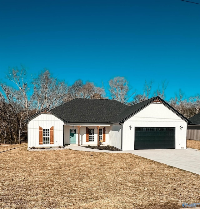 view of front of house with a garage and a front yard