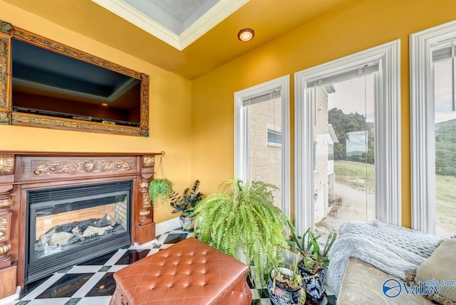 living room featuring crown molding