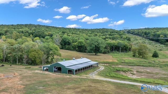 birds eye view of property with a rural view