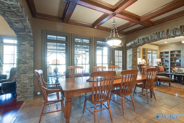 dining room featuring beamed ceiling, decorative columns, and coffered ceiling