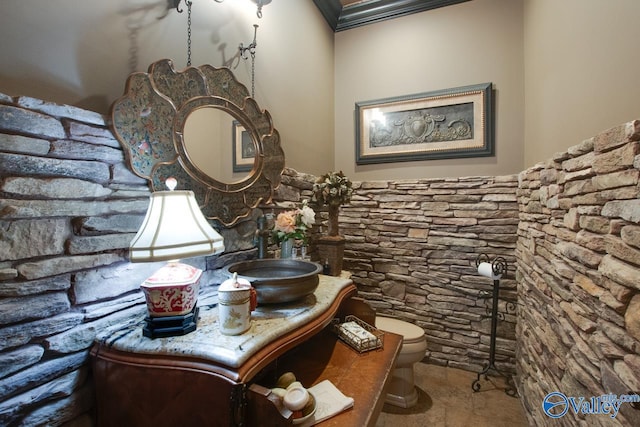 bathroom featuring toilet, tile patterned floors, and vanity