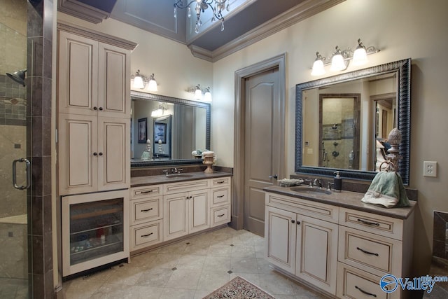 bathroom featuring ornamental molding, a shower with door, and vanity