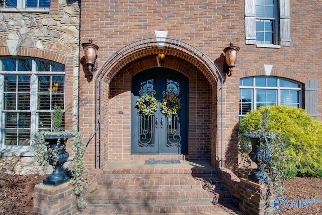 property entrance featuring french doors