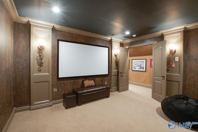 carpeted home theater with ornamental molding