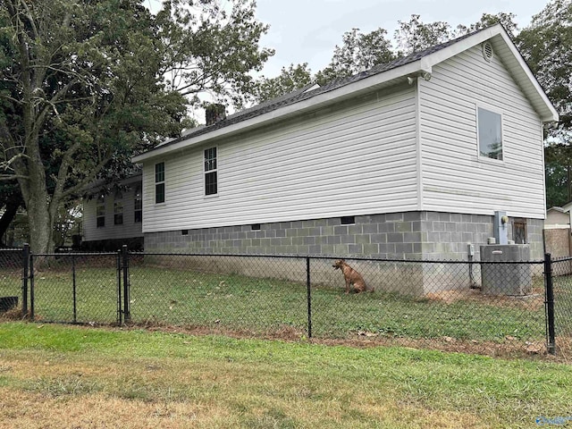 view of property exterior with crawl space, fence, and a lawn