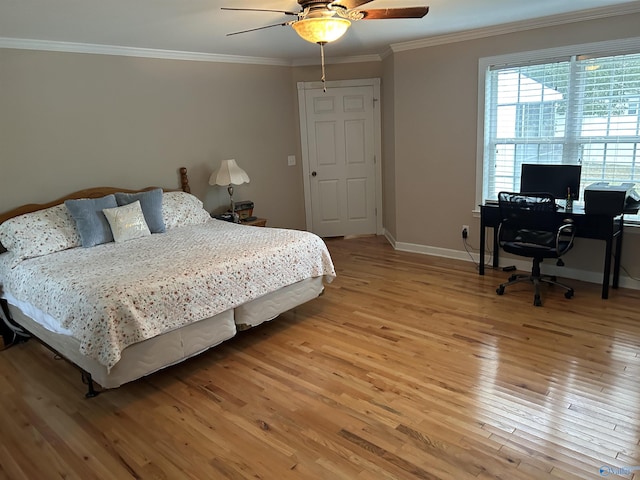 bedroom with ornamental molding, light wood-type flooring, baseboards, and a ceiling fan