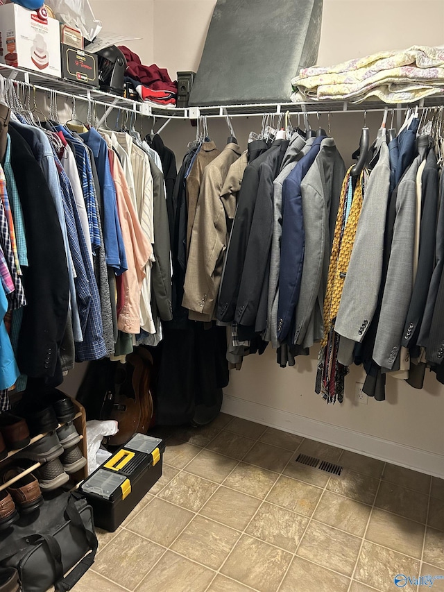 spacious closet with tile patterned flooring and visible vents