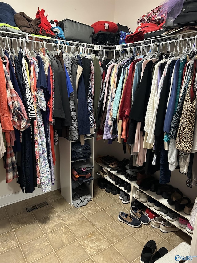 spacious closet featuring tile patterned flooring and visible vents