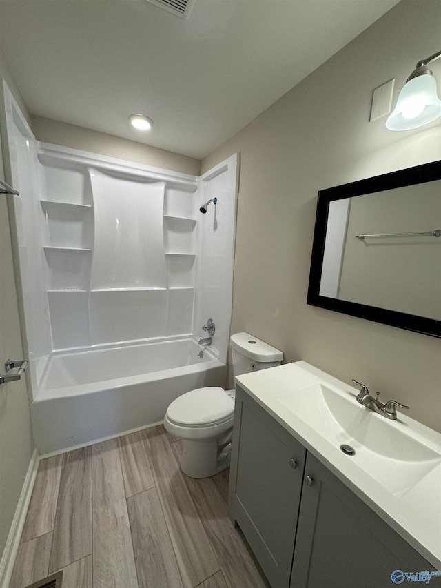 full bathroom featuring toilet, vanity, and shower / bathing tub combination