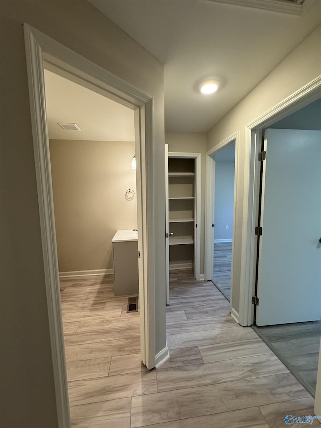 hall featuring light hardwood / wood-style floors