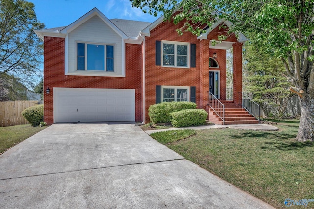 raised ranch featuring concrete driveway, an attached garage, a front yard, brick siding, and fence