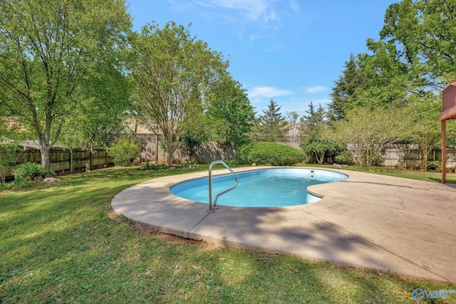 view of swimming pool with a patio, a fenced backyard, a fenced in pool, and a lawn