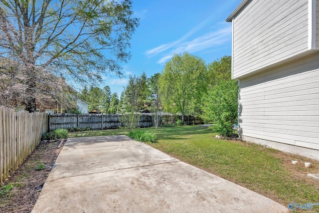 view of yard featuring a patio and a fenced backyard