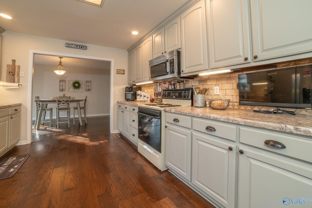 kitchen featuring white cabinetry, electric range, dark wood-type flooring, decorative light fixtures, and decorative backsplash