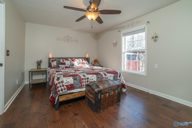 bedroom with ceiling fan and dark hardwood / wood-style flooring