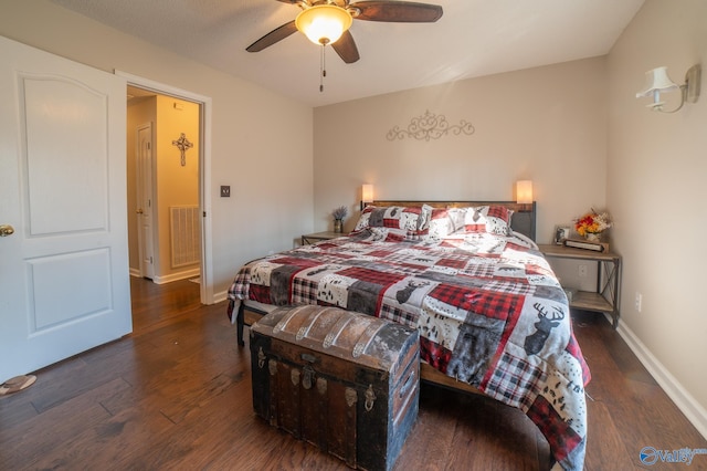 bedroom with dark hardwood / wood-style floors and ceiling fan