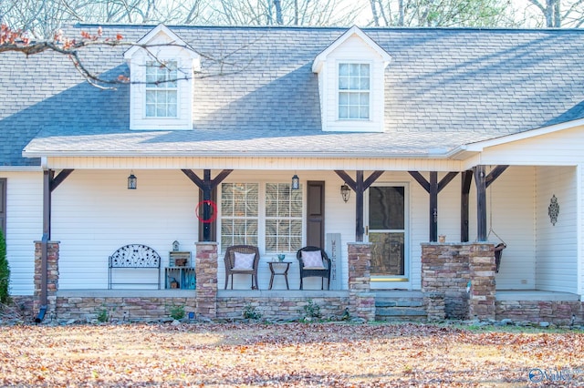 cape cod home with covered porch