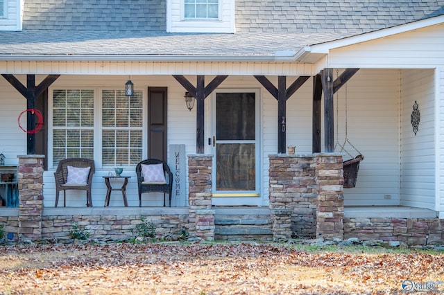 doorway to property featuring covered porch