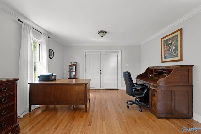 office area with light wood finished floors and ornamental molding