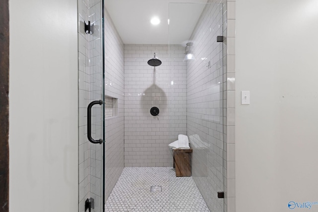 bathroom featuring recessed lighting and a shower stall