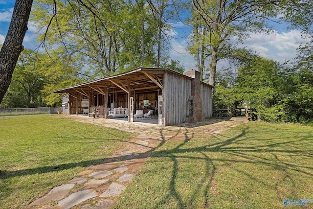 view of outdoor structure with fence