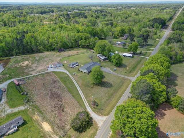 birds eye view of property with a forest view