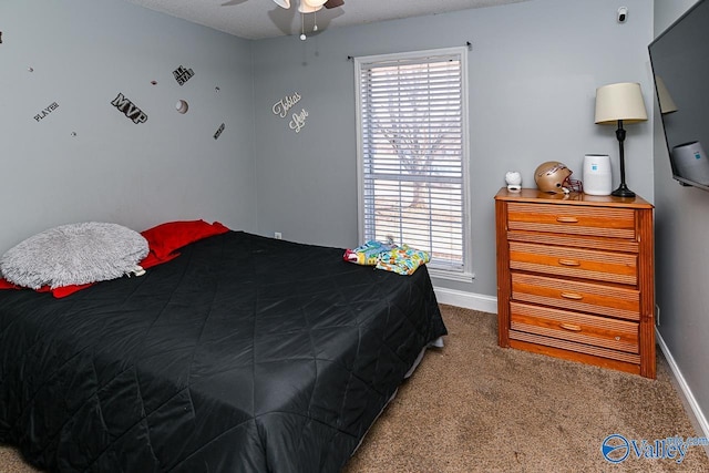 bedroom with carpet floors, multiple windows, and baseboards