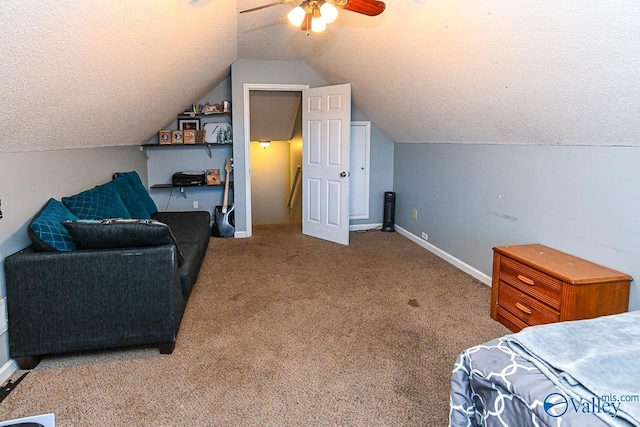 bedroom featuring light carpet, a textured ceiling, vaulted ceiling, and baseboards