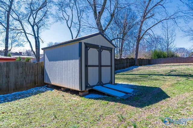 view of shed featuring a fenced backyard