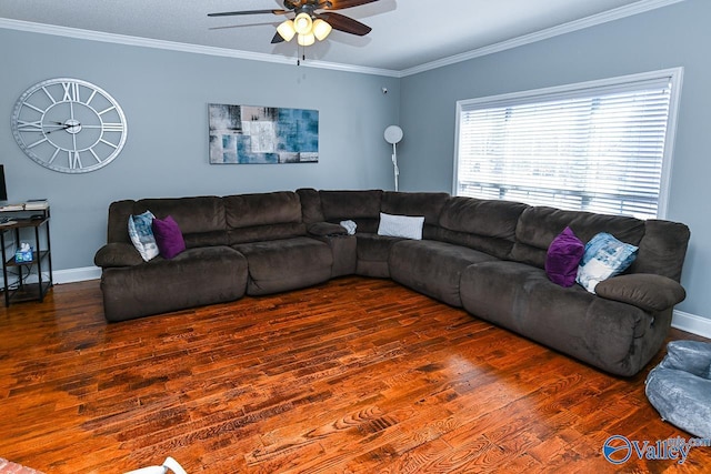 living room featuring ceiling fan, dark wood-style flooring, baseboards, and crown molding