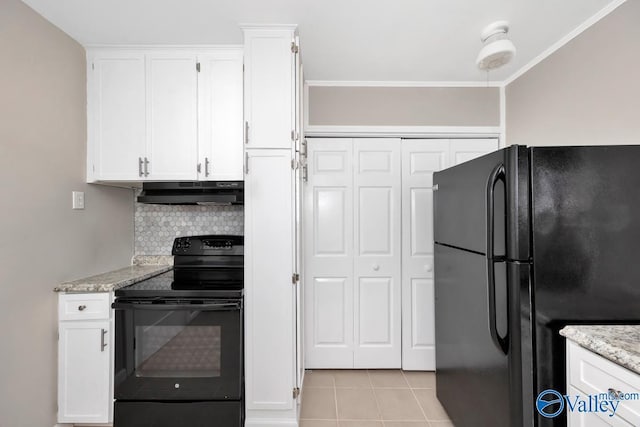 kitchen featuring white cabinetry, under cabinet range hood, black appliances, and light tile patterned floors