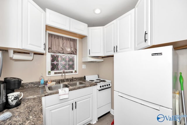 kitchen featuring recessed lighting, white appliances, a sink, white cabinetry, and dark countertops