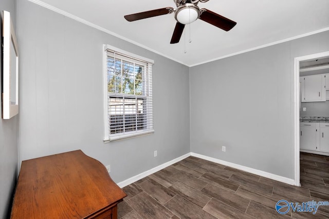 unfurnished bedroom with ceiling fan, baseboards, crown molding, and wood finish floors