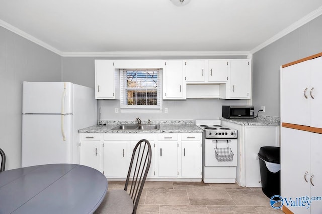 kitchen featuring light countertops, white appliances, white cabinetry, and crown molding