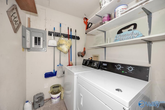 laundry area with laundry area, electric panel, and washer and clothes dryer